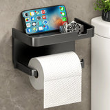 Adhesive toilet paper holder with phone shelf mounted on a bathroom wall, shown in white